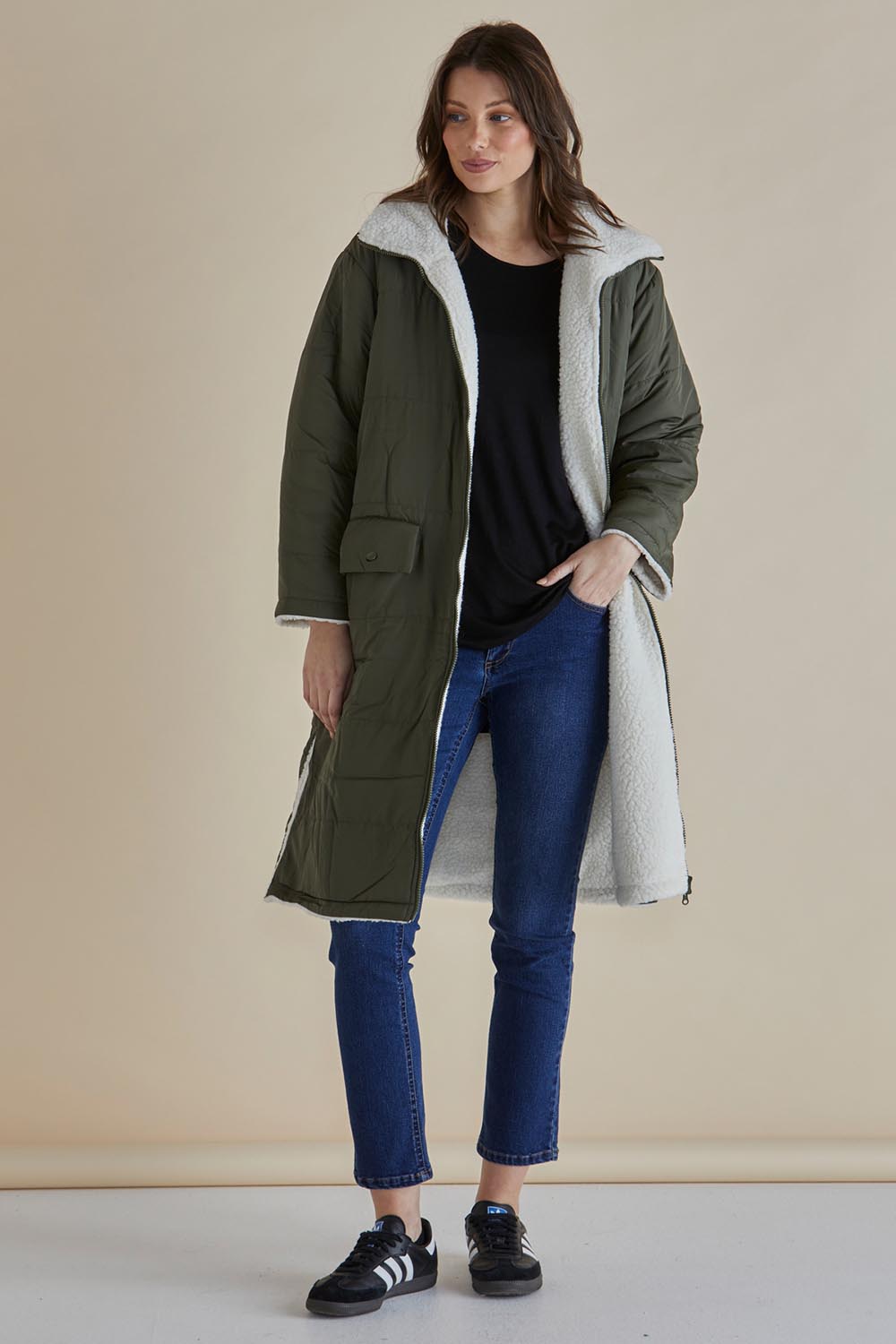A model wearing the Valkyrie Puffer Jacket in colour Darkgreen (Green), from the front, showing the whole outfit