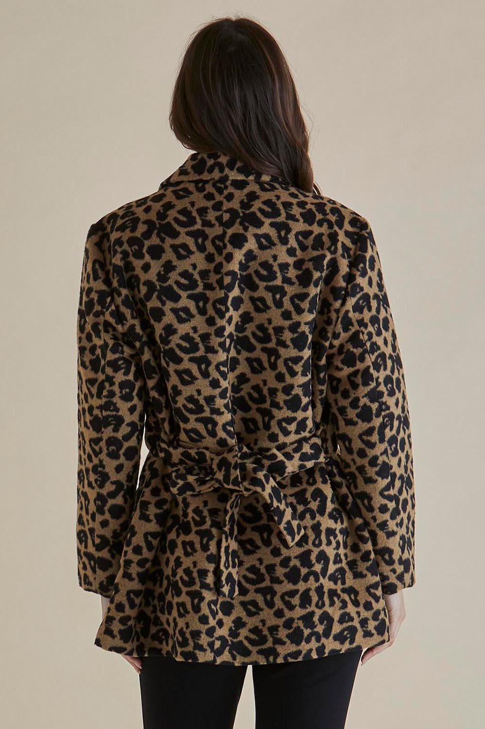 A model wearing the Prague Coat in colour Animal, from the back