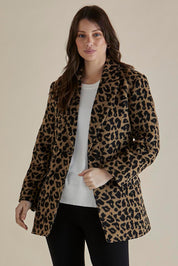 A model wearing the Prague Coat in colour Animal, from the front, cropped image