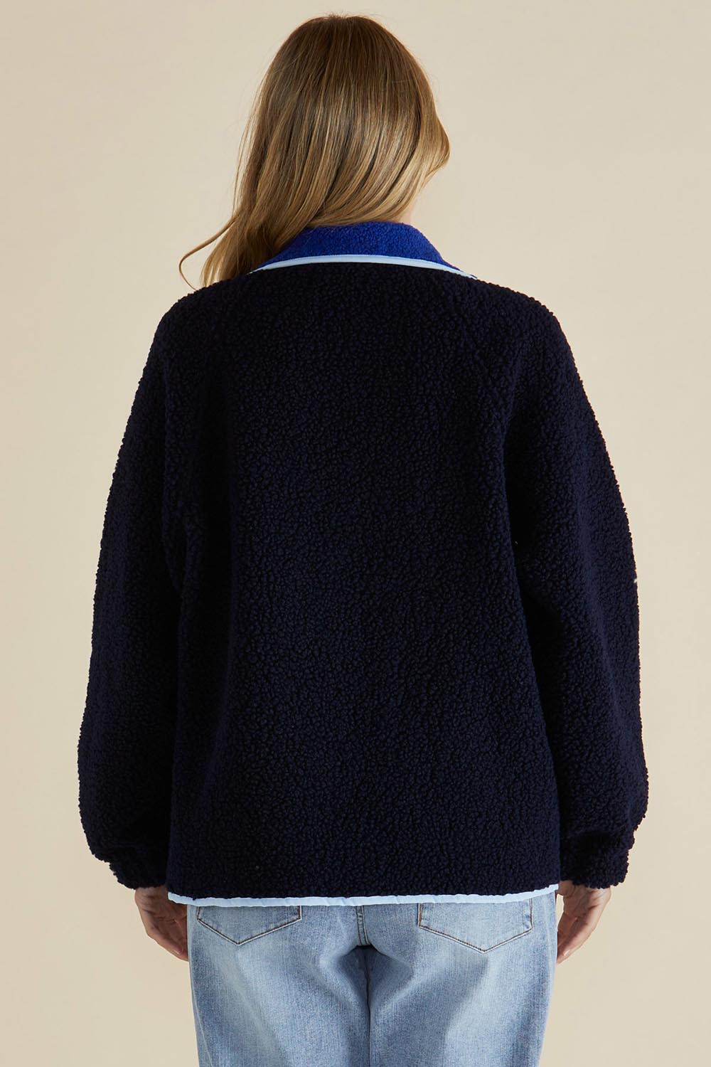 A model wearing the Franklin Fleecy Jacket in colour Blue (Blue), from the back