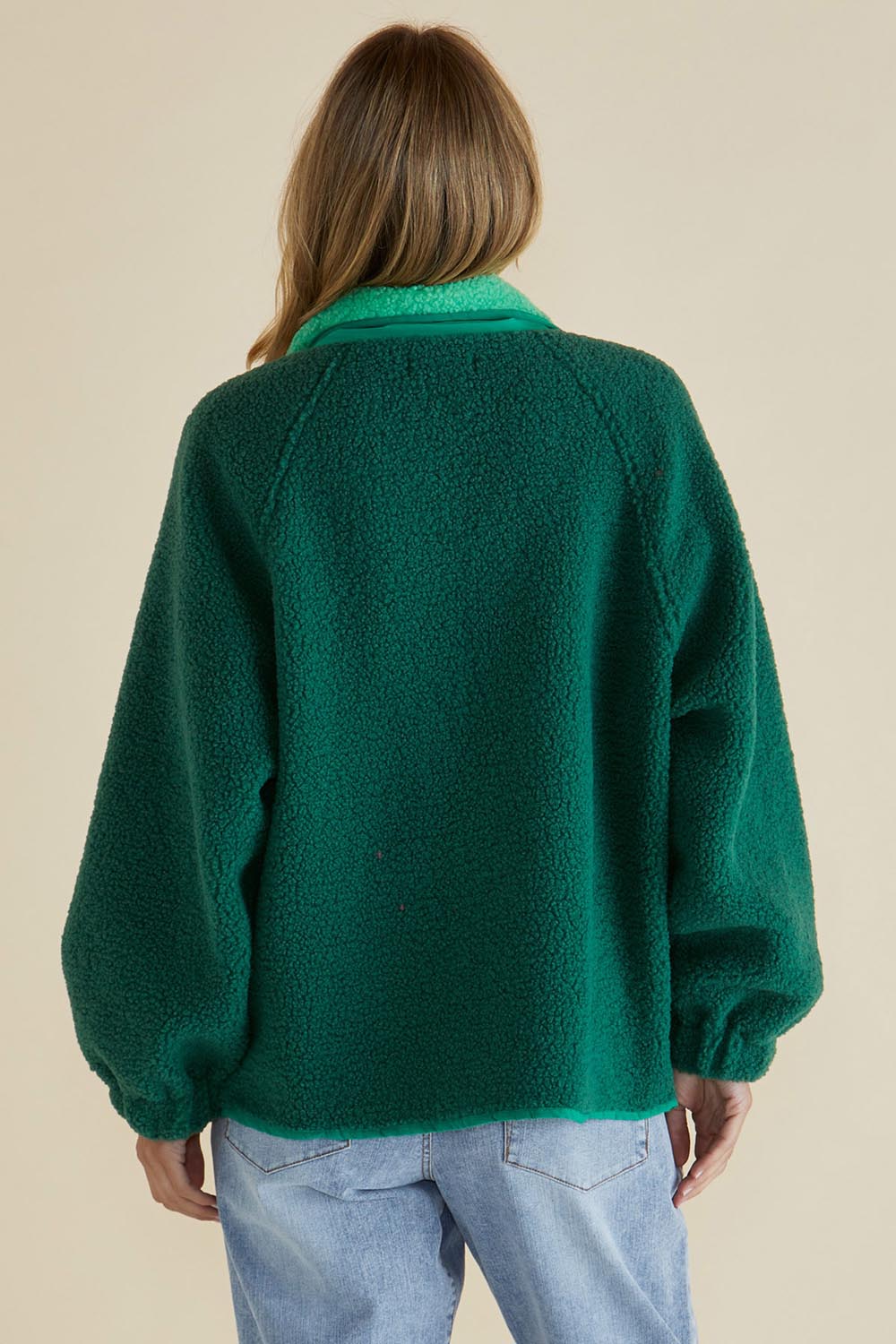 A model wearing the Franklin Fleecy Jacket in colour Green (Green), from the back