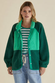 A model wearing the Franklin Fleecy Jacket in colour Green (Green), from the front, cropped image