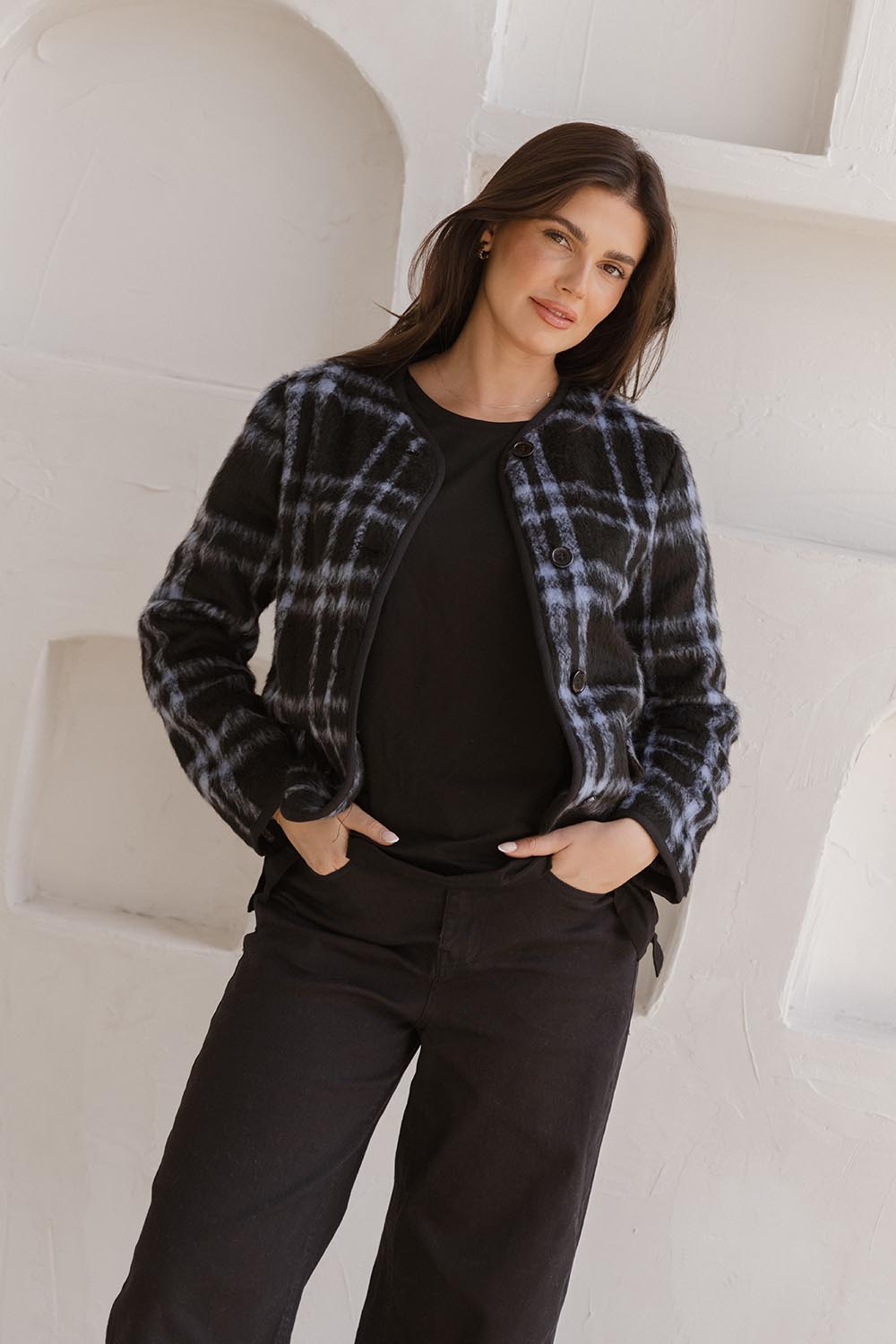 A model wearing the Charlie Check Coat in colour Bluecheck (Blue), from the front, showing the whole outfit