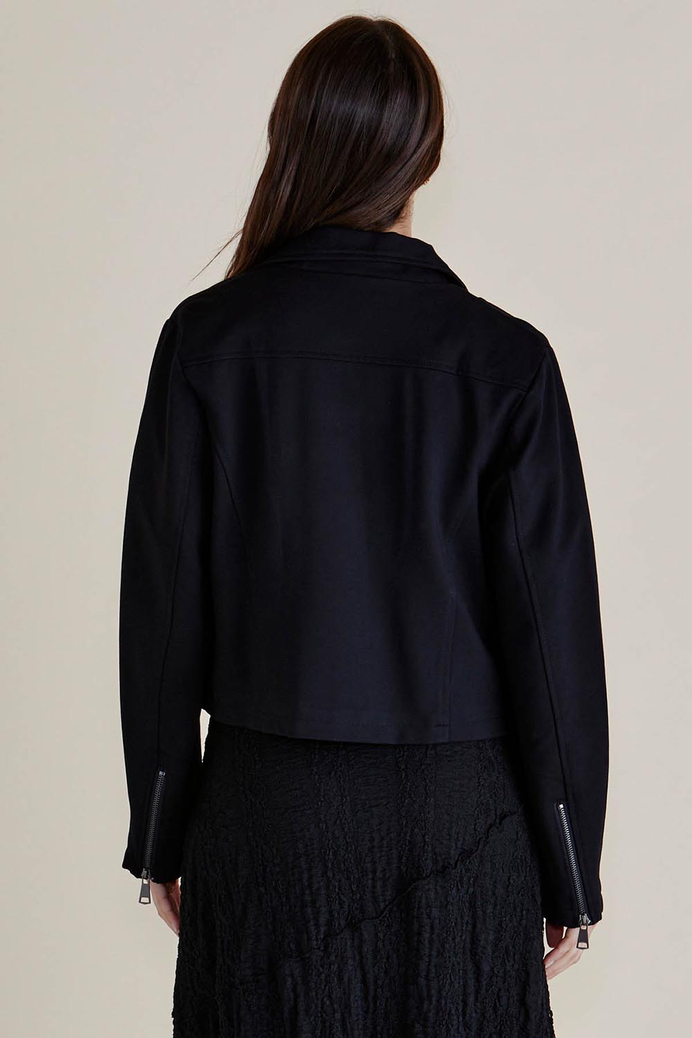 A model wearing the Aurora Ponte Biker Jacket in colour Black (Black), from the back