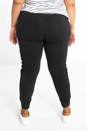 Model Alexis wearing size 16 of the Max Jogger in colour Black (Black), from the back