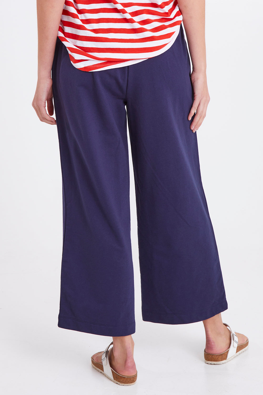 Model Madeline wearing size 10 of the Rizzo Relaxed Jogger in colour Navy (Blue), from the back