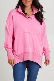 Model Katie wearing size 10 of the Sadie Sweat in colour Bpink (Pink), from the front, cropped image