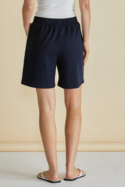 A model wearing the Harvard Cotton Short in colour Blue (Blue), from the back