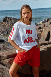 A model wearing the Harvard Cotton Short in colour Red (Red), from the front, showing the whole outfit