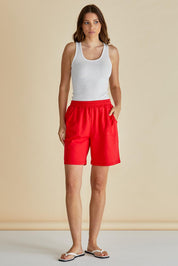 A model wearing the Harvard Cotton Short in colour Red (Red), from the front, showing the whole outfit