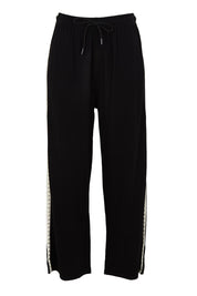 Product shot of the Evelyn Wide Leg Jogger in colour Blacktrim (Black), from the front