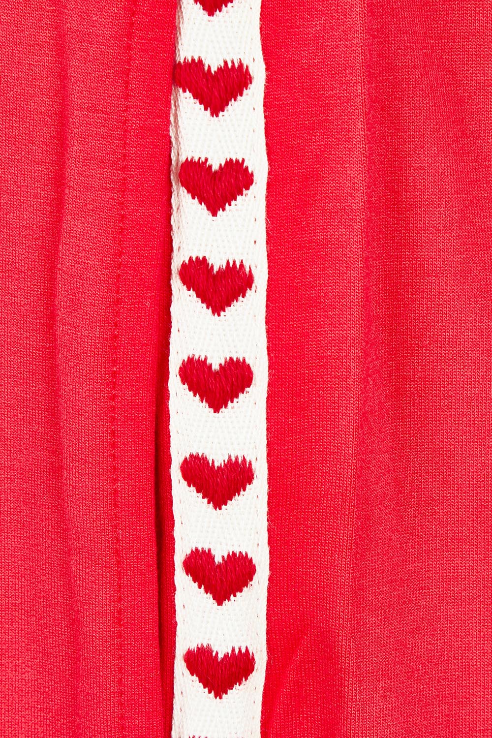Product shot of the Evelyn Wide Leg Jogger in colour Redtrim (Red), detail