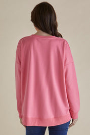 A model wearing the Sonya Cotton Blend Sweat in colour Loveprint (Pink), from the back