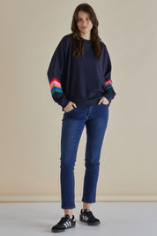A model wearing the Davina Cotton Blend Jumper in colour Bluemulti (Blue), from the front, showing the whole outfit