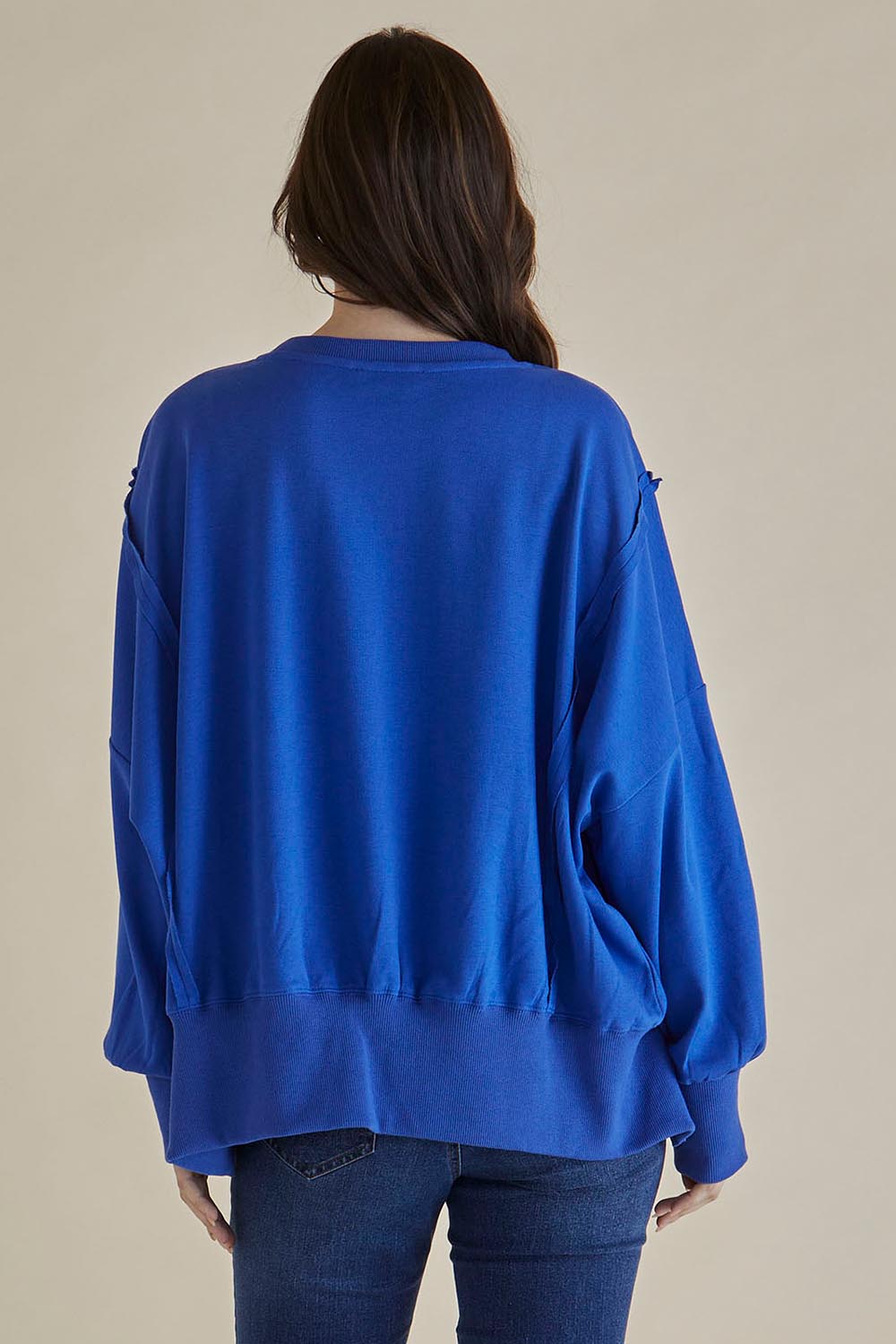 A model wearing the Mykie Cotton Blend Jumper in colour Blue (Blue), from the back