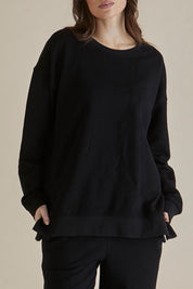 A model wearing the Easy Crew Cotton Sweat in colour Black (Black), from the front, cropped image