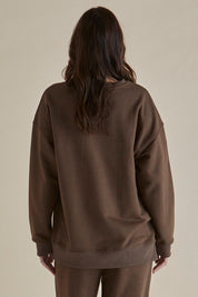 A model wearing the Easy Crew Cotton Sweat in colour Chocolate, from the back
