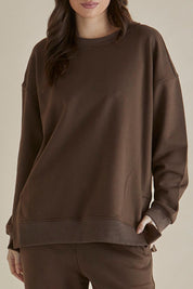 A model wearing the Easy Crew Cotton Sweat in colour Chocolate, from the front, cropped image