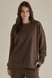 A model wearing the Easy Crew Cotton Sweat in colour Chocolate, from the front, cropped image