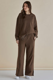 A model wearing the Easy Crew Cotton Sweat in colour Chocolate, from the front, showing the whole outfit