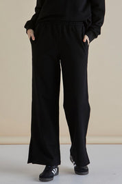 A model wearing the Pace Cotton Jogger in colour Black (Black), from the front, cropped image