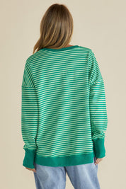 A model wearing the Cove Cotton Blend Sweat Jumper in colour Green (Green), from the back