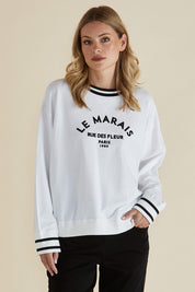 A model wearing the Marais Cotton Sweat in colour White (White), from the front, cropped image