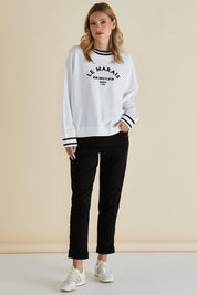 A model wearing the Marais Cotton Sweat in colour White (White), from the front, showing the whole outfit