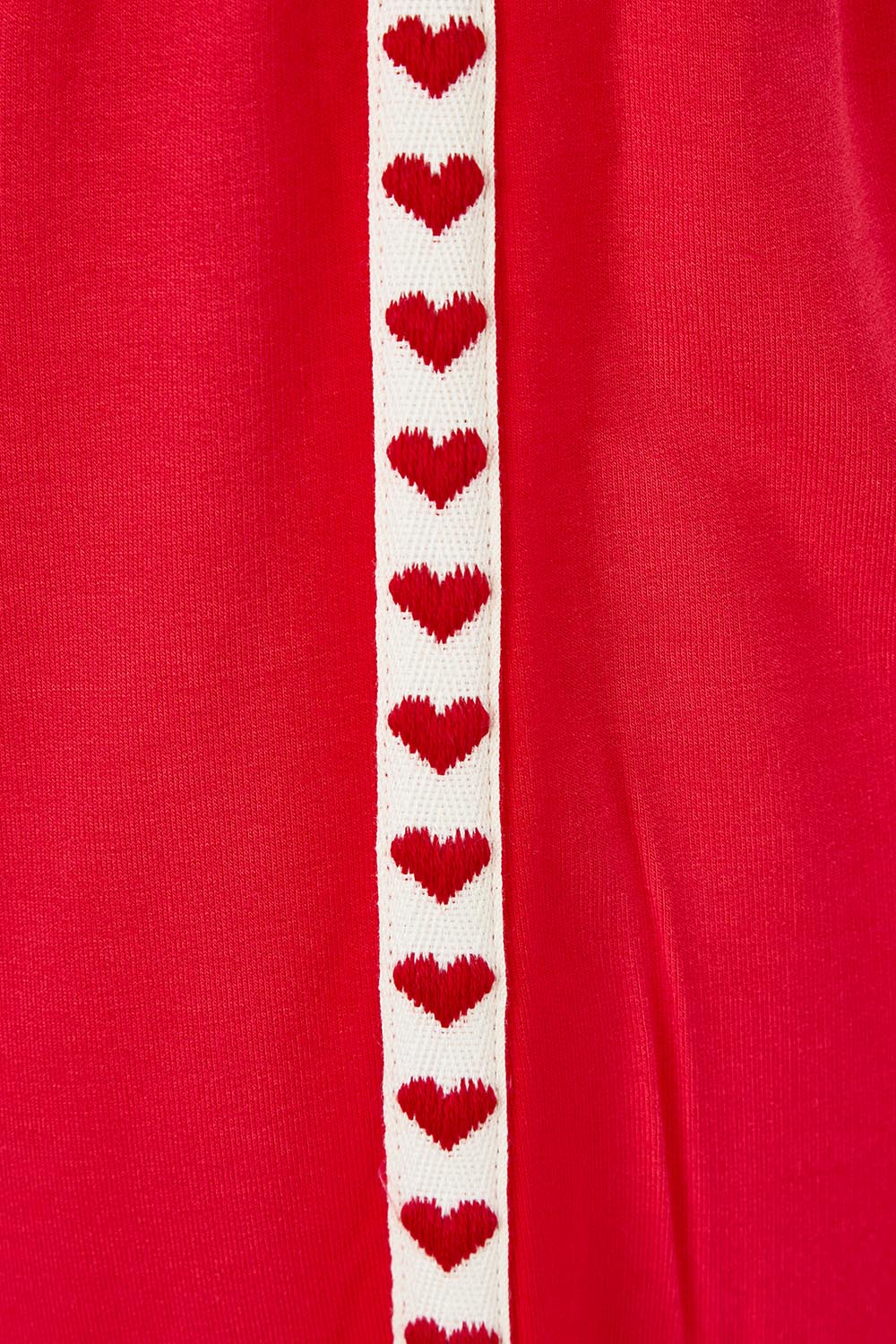 Product shot of the Sia Wide Leg Short in colour Redtrim (Red), detail