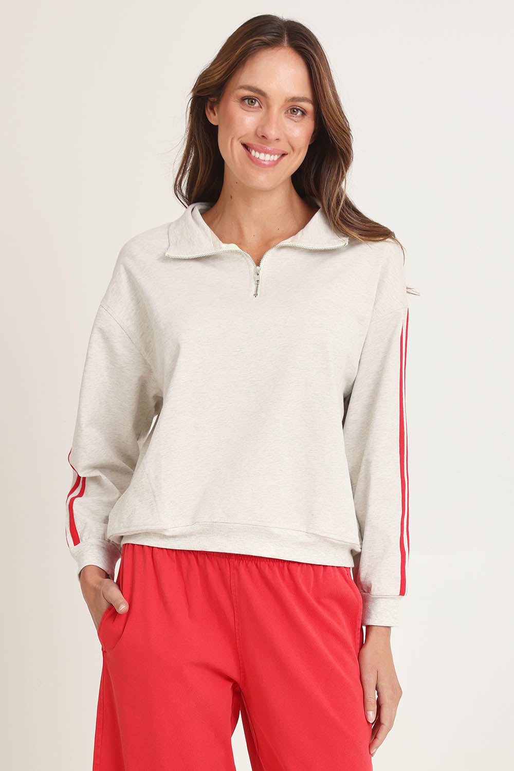 Model Madeline wearing size 10 of the Rocco Quarter Zip Cotton Sweatshirt in colour Greymarle (Grey), from the front, cropped image