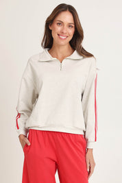 Model Madeline wearing size 10 of the Rocco Quarter Zip Cotton Sweatshirt in colour Greymarle (Grey), from the front, cropped image