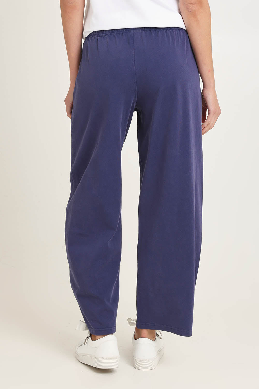 Model Madeline wearing size 10 of the Barrel Leg Cotton Sweatpant in colour Navy (Blue), from the back