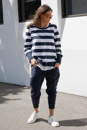 A model wearing the Dolly Sweat in colour Navywhite (Blue), from the front, showing the whole outfit