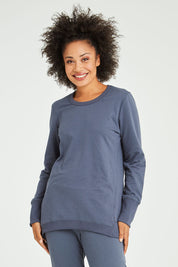 Model Olivia wearing size 10 of the Dolly Sweat in colour Indiblue (Blue), from the front, cropped image