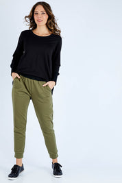 Model Madeline wearing size 10 of the Lindsay Jogger in colour Khaki (Green), from the front, showing the whole outfit