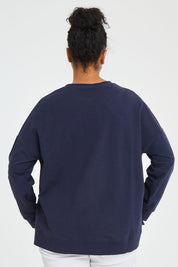 Model Noli wearing size 14 of the Sienna Sweat in colour Navy (Green), from the back