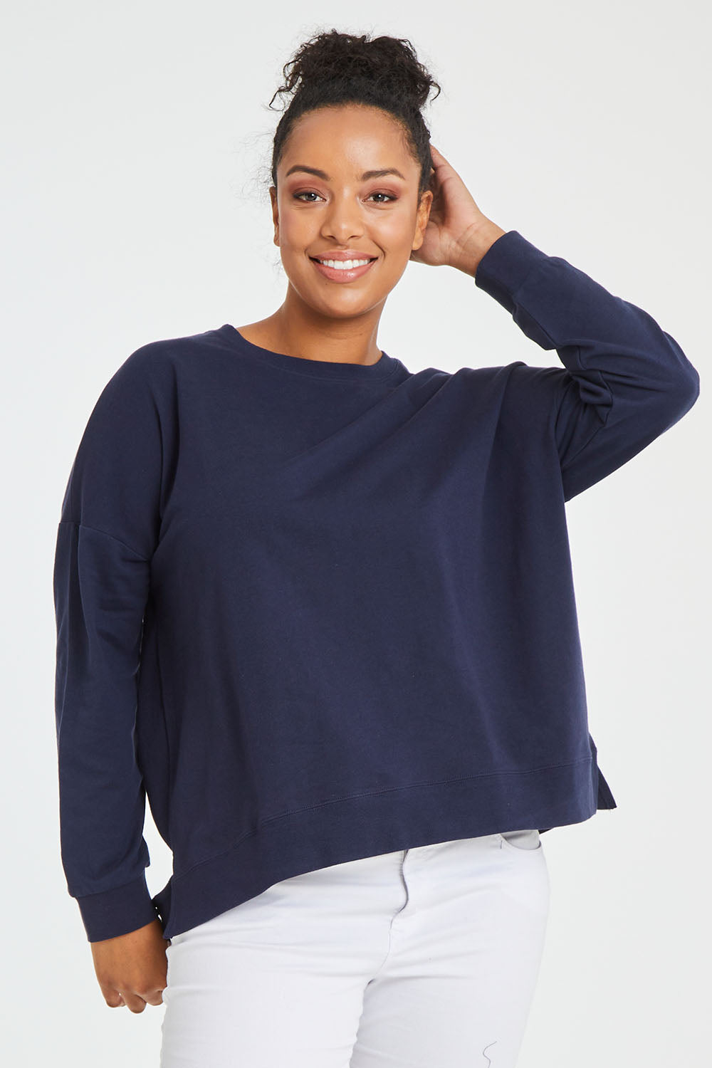 Model Noli wearing size 14 of the Sienna Sweat in colour Navy (Green), from the front, cropped image