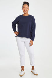 Model Noli wearing size 14 of the Sienna Sweat in colour Navy (Green), from the front, showing the whole outfit