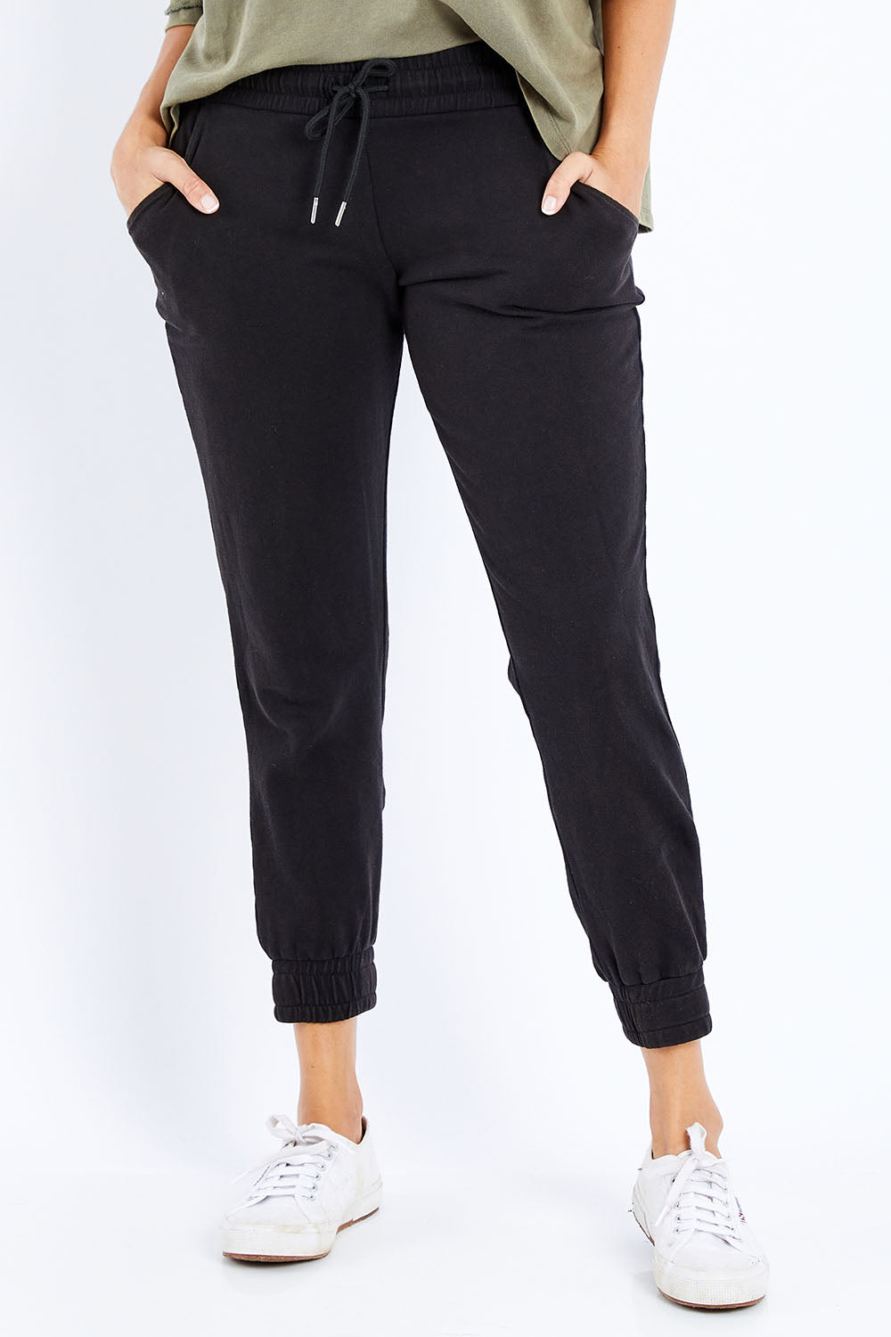 Model Lala wearing size 10 of the Coco Pant in colour Black (Black), from the front, cropped image
