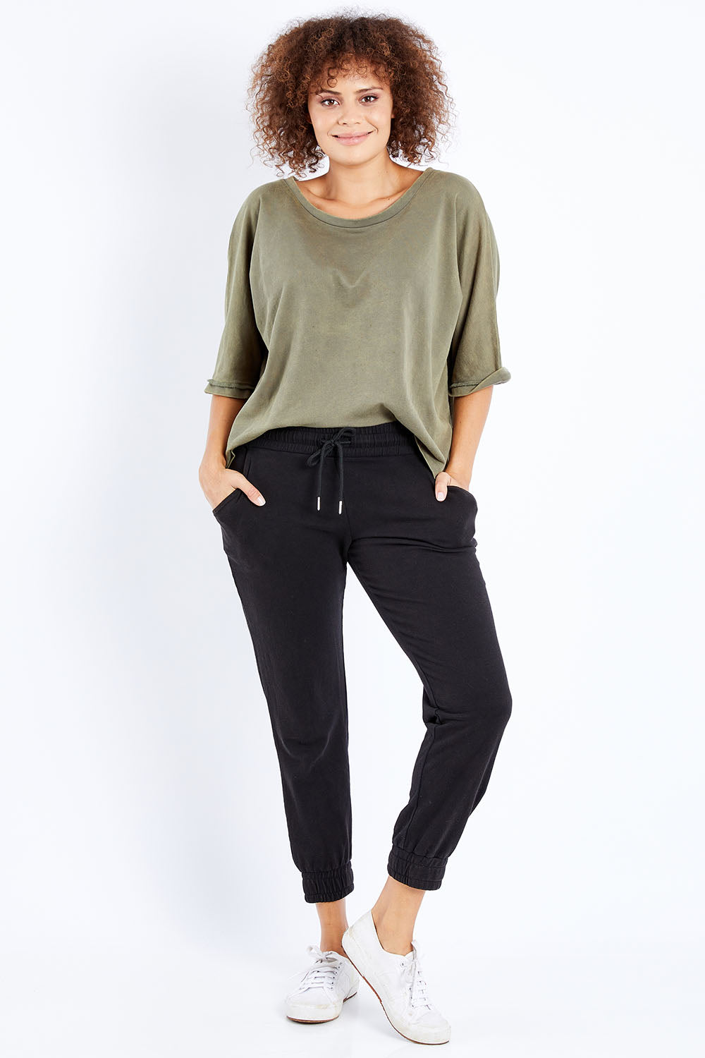 Model Lala wearing size 10 of the Coco Pant in colour Black (Black), from the front, showing the whole outfit
