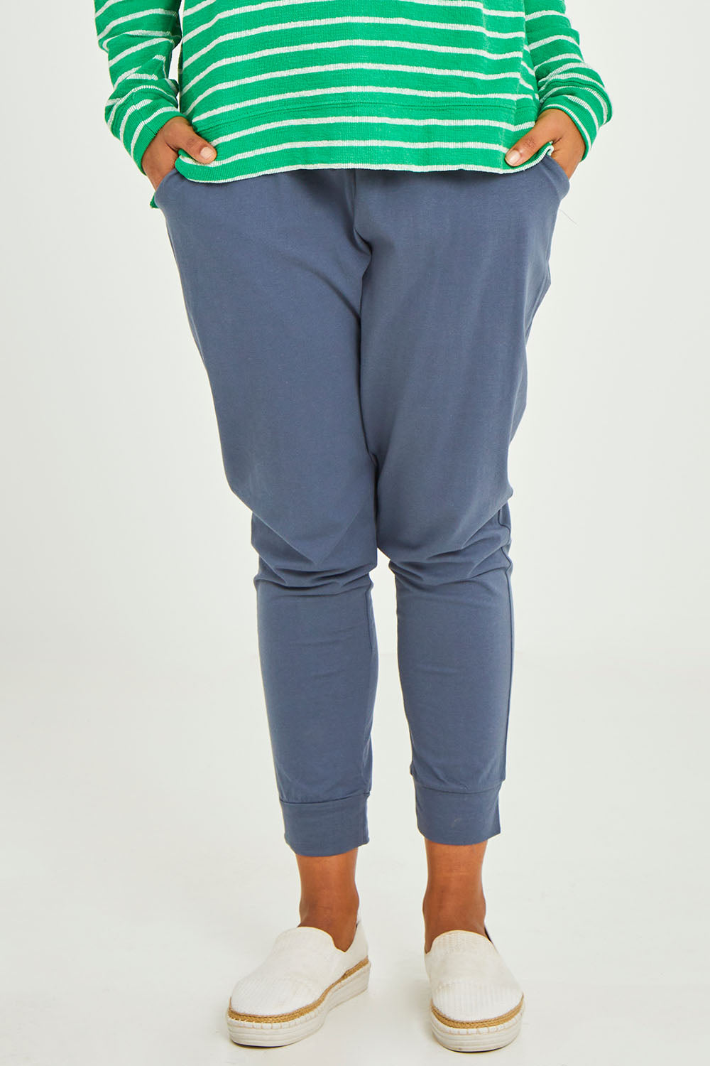 Model Olivia wearing size 10 of the Marissa Jogger in colour Indiblue (Blue), from the front, cropped image