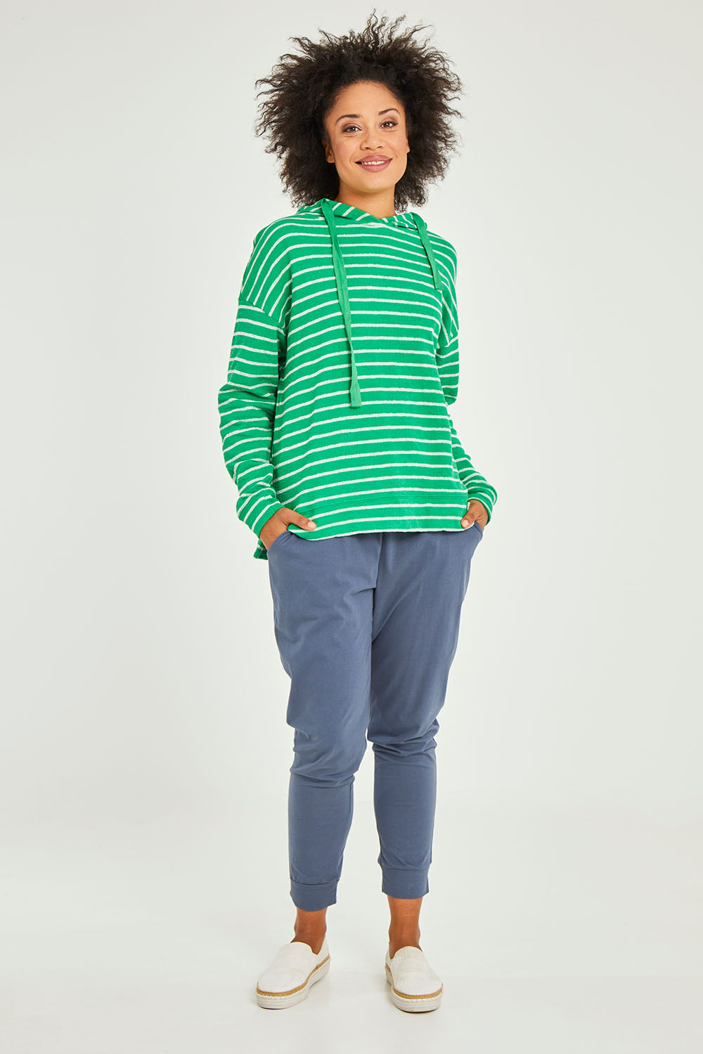 Model Olivia wearing size 10 of the Marissa Jogger in colour Indiblue (Blue), from the front, showing the whole outfit