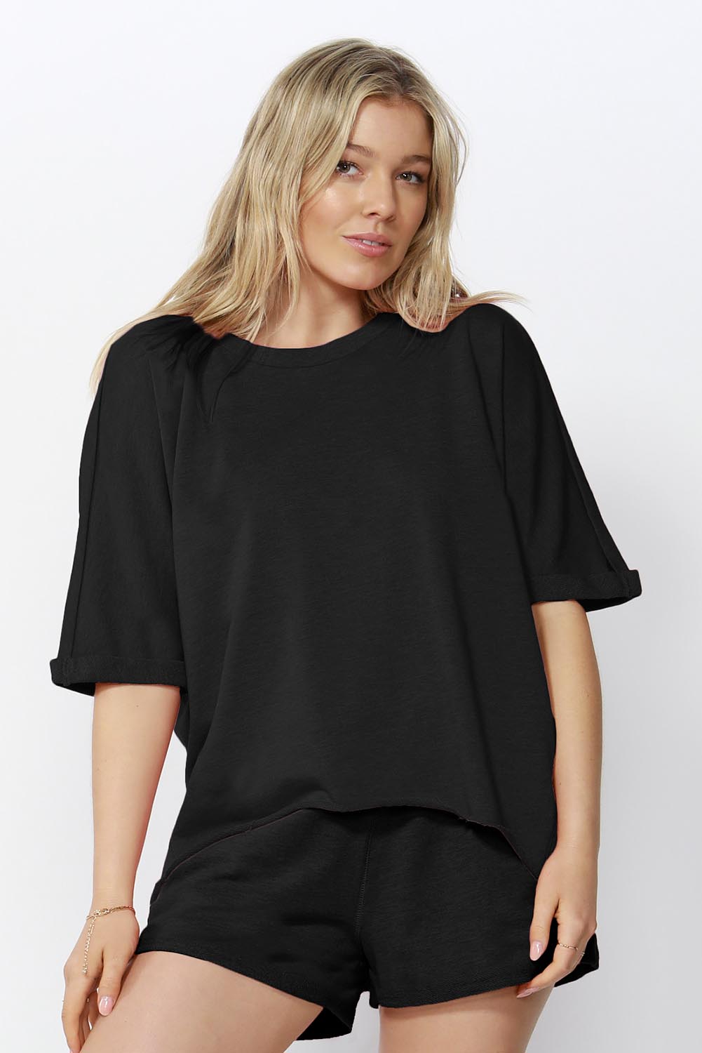 A model wearing the Chet Sweat in colour Black (Black), from the front, cropped image