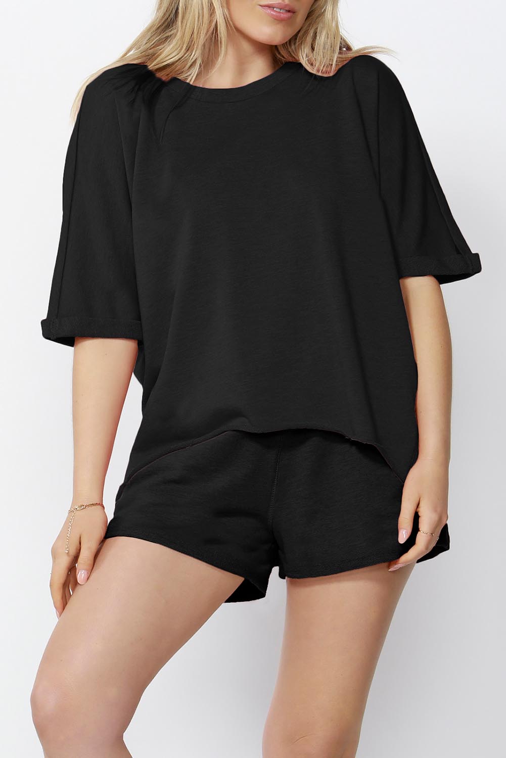 A model wearing the Chet Sweat in colour Black (Black), from the front, cropped image