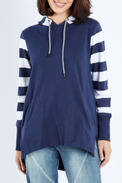 Model Andrea wearing size 10 of the Colbie Hoodie in colour Navymulti (Blue), from the front, cropped image
