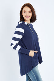Model Andrea wearing size 10 of the Colbie Hoodie in colour Navymulti (Blue), from the front, cropped image