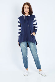 Model Andrea wearing size 10 of the Colbie Hoodie in colour Navymulti (Blue), from the front, showing the whole outfit