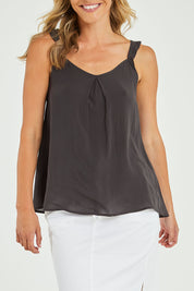 Model Alice wearing size 10 of the Jenna Top in colour Petrol (Black), from the front, cropped image