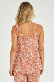 Model Alice wearing size 10 of the Jenna Top in colour Sarabi, from the back