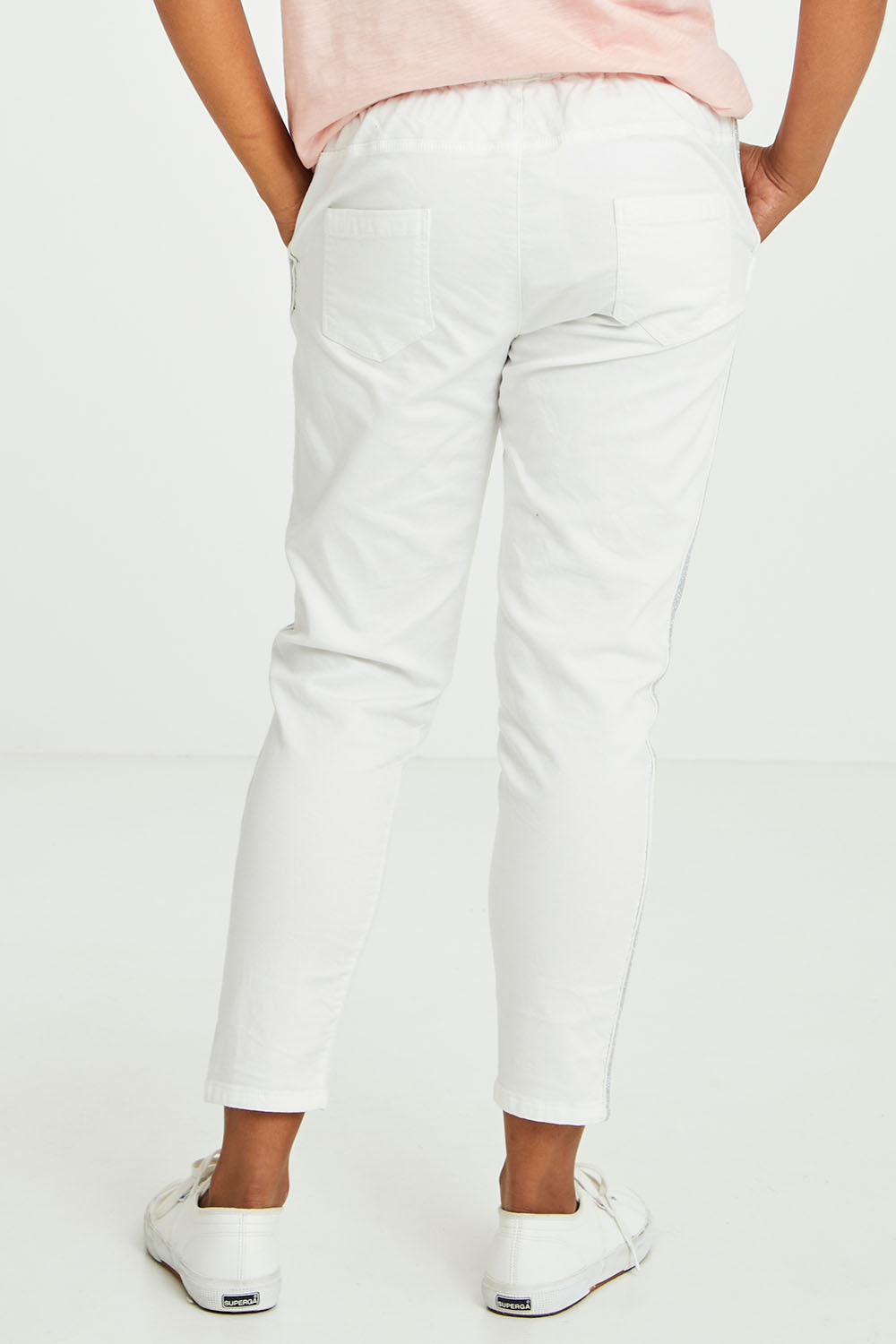 Model Olivia wearing size 10 of the Brooks Jean in colour White (White), from the back